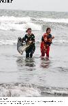 Next picture :: Girls enjoy walk in water at seaside during hot weather in the city on Wednesday.